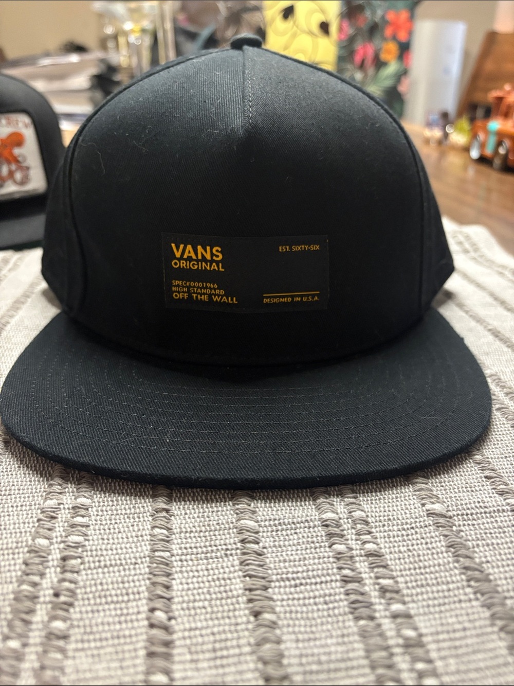 Vans Black Snapback Cap with Gold Logo Patch